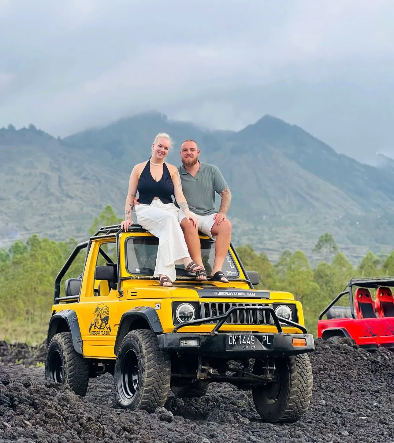 Travellers on a yellow jeep in Kintamani