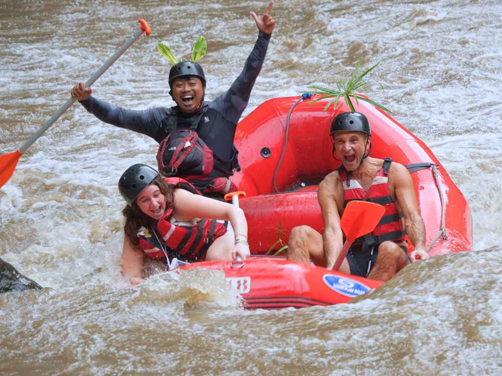 Rafting guests enjoying the river rapids