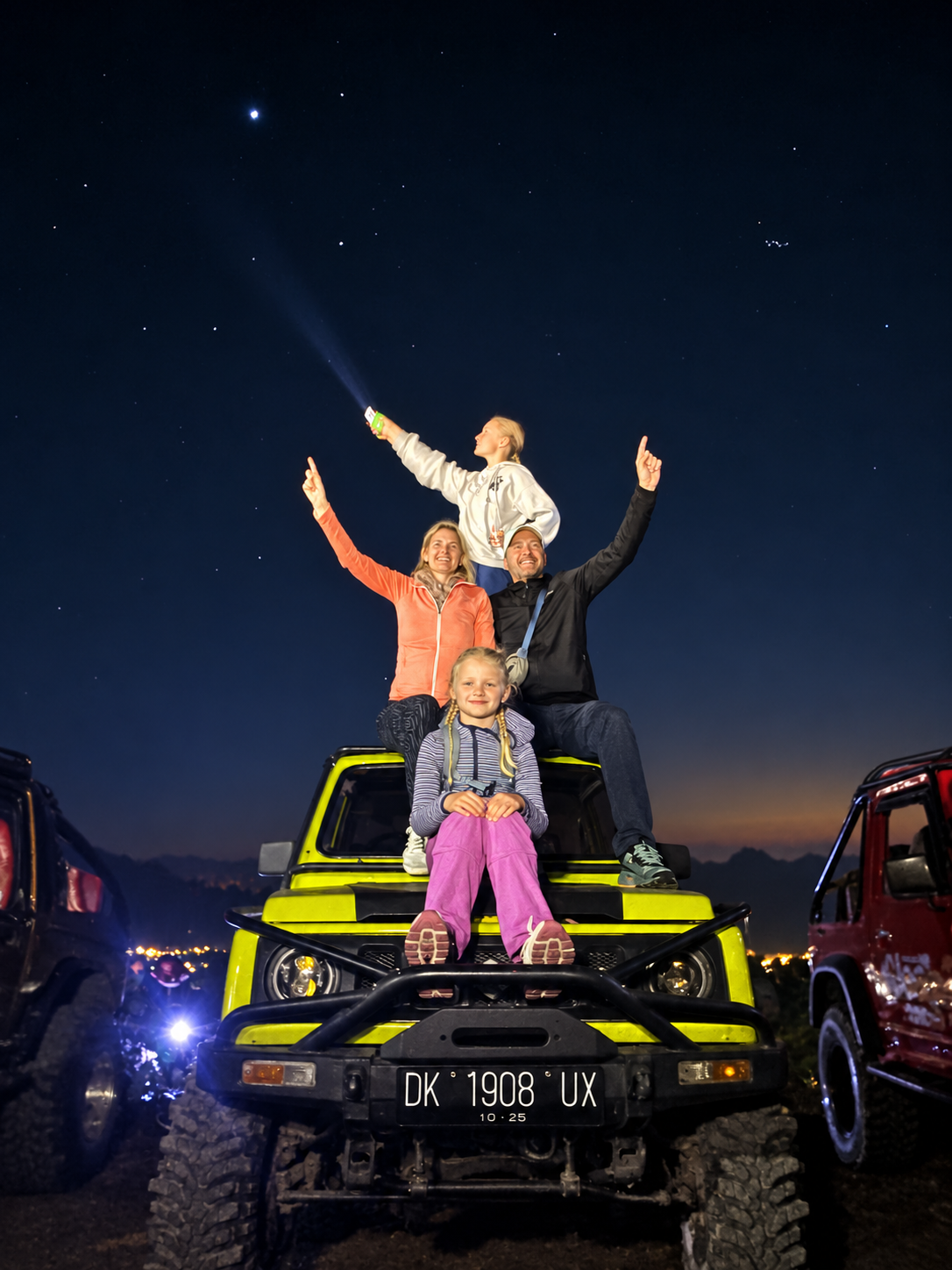 Family on a jeep before dawn